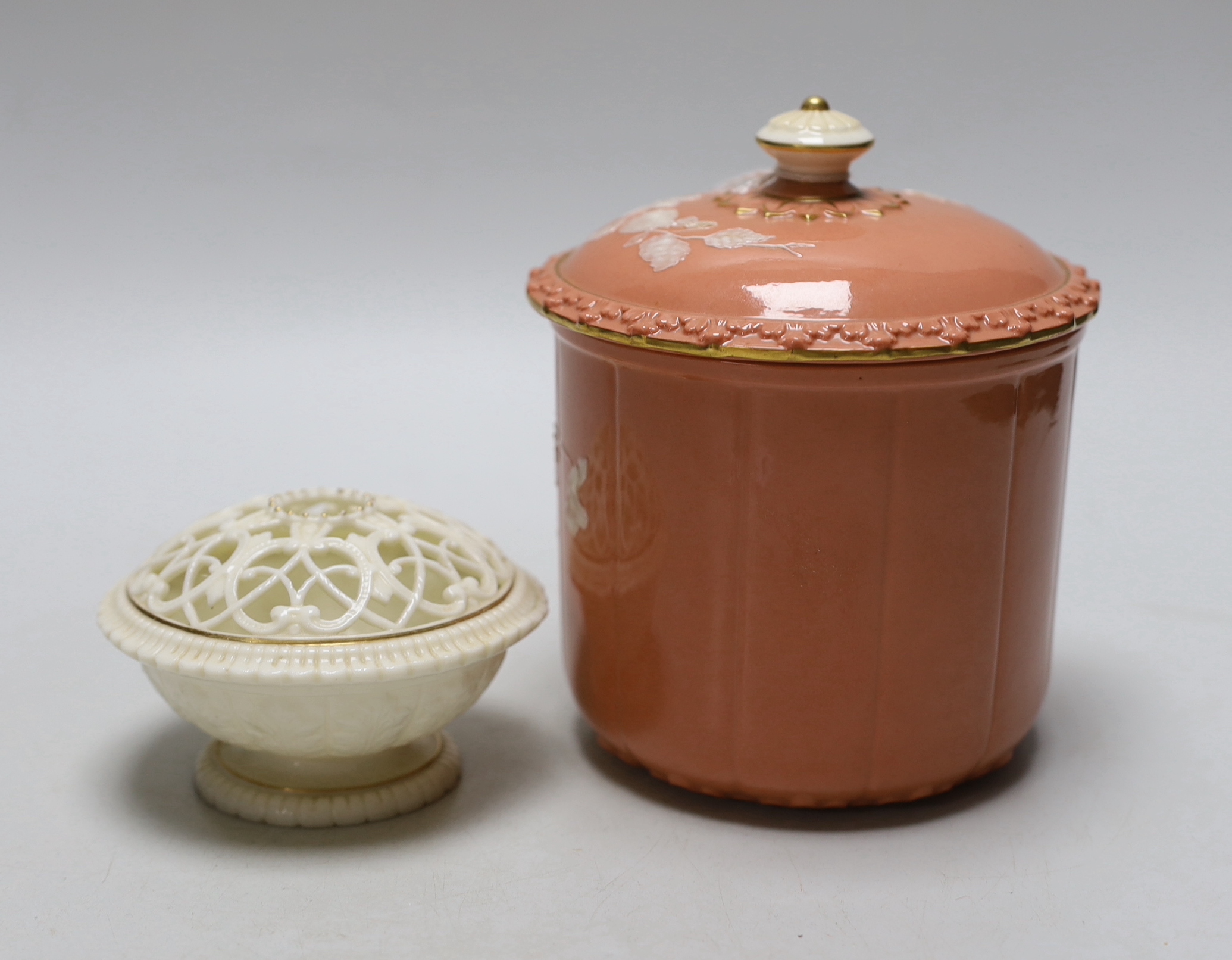 A Grainger’s or Locke Worcester pate-sur-pate jar and cover, the salmon ground decorated with white flowers and a Grainger’s white glaze and gilt pot pourri both c.1880, the largest 15cm high